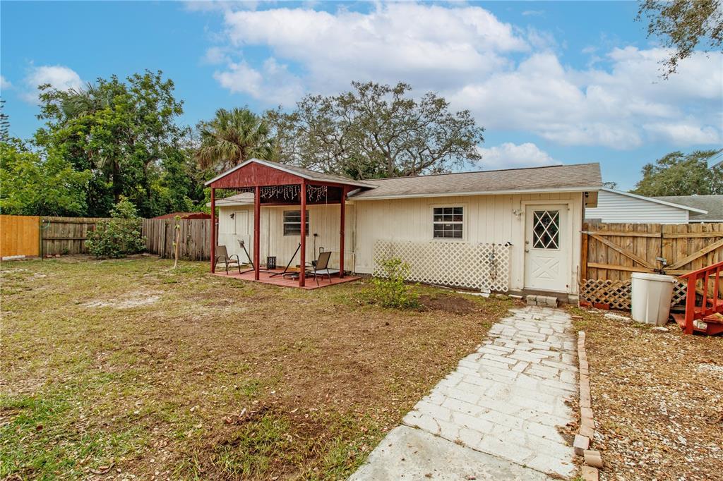 525 4th Avenue Southwest Largo, FL 33770 - Photo 23 of 27 a front view of a house with garden