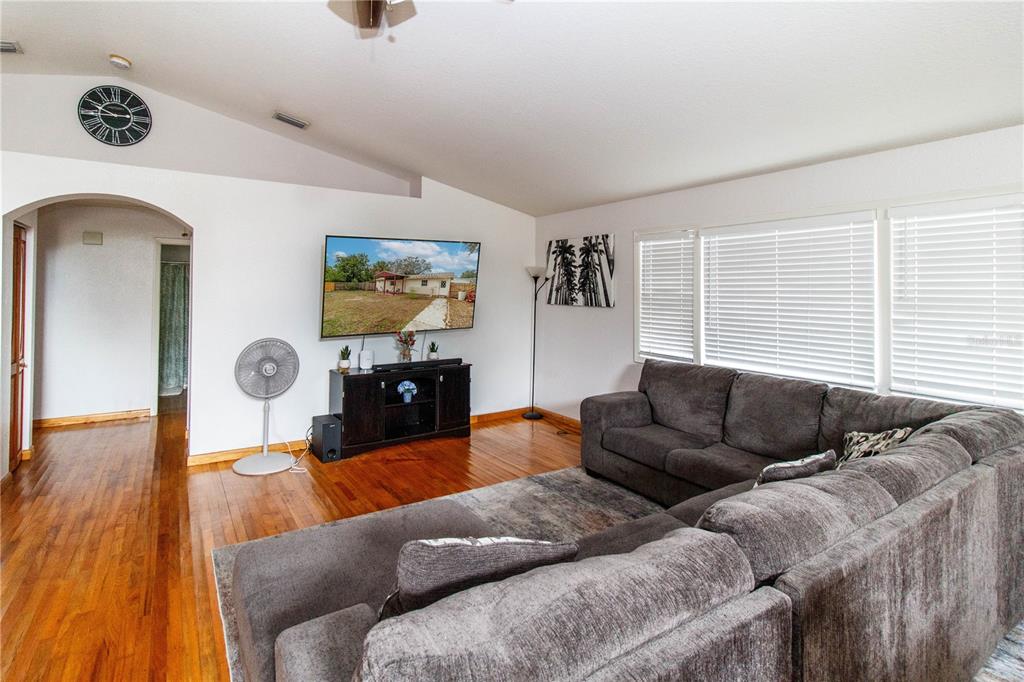 525 4th Avenue Southwest Largo, FL 33770 - Photo 3 of 27 a living room with furniture and a flat screen tv