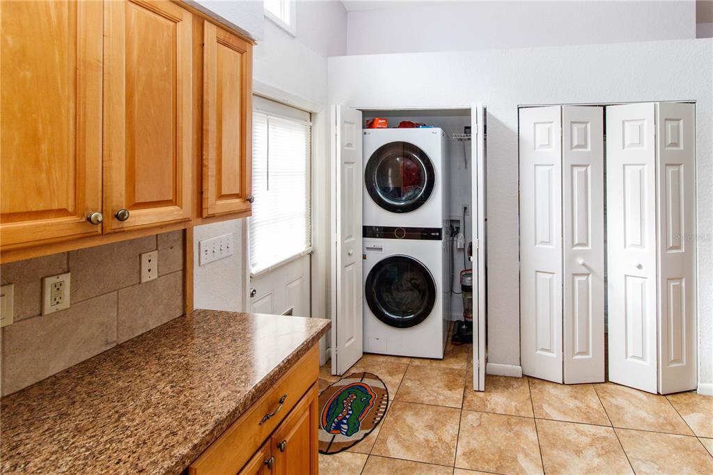 525 4th Avenue Southwest Largo, FL 33770 - Photo 9 of 27 a view of a storage and utility room with washer and dryer