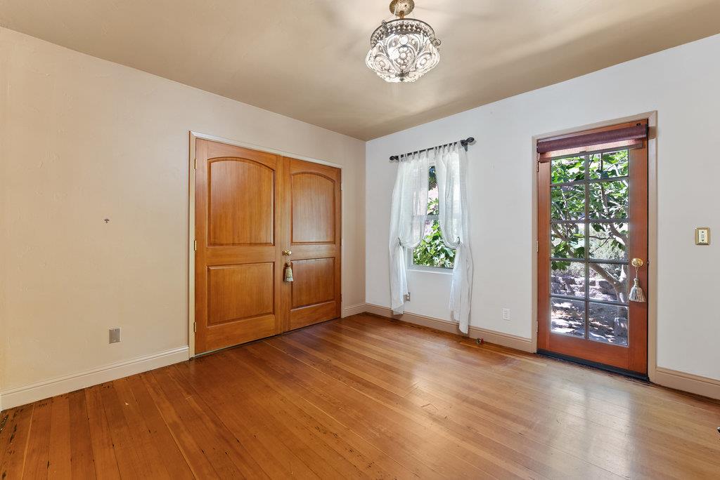 2970 Freedom Boulevard Watsonville, CA 95076 - Photo 16 of 58 an empty room with wooden floor cabinet and windows