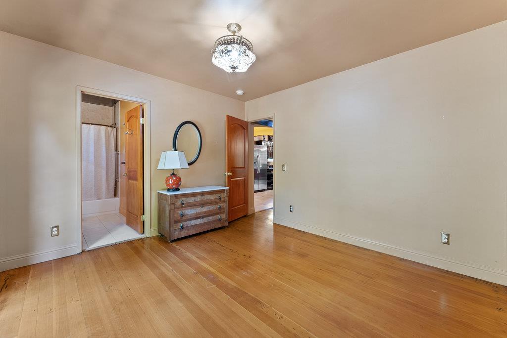 2970 Freedom Boulevard Watsonville, CA 95076 - Photo 17 of 58 a view of a bedroom with wooden floor and window