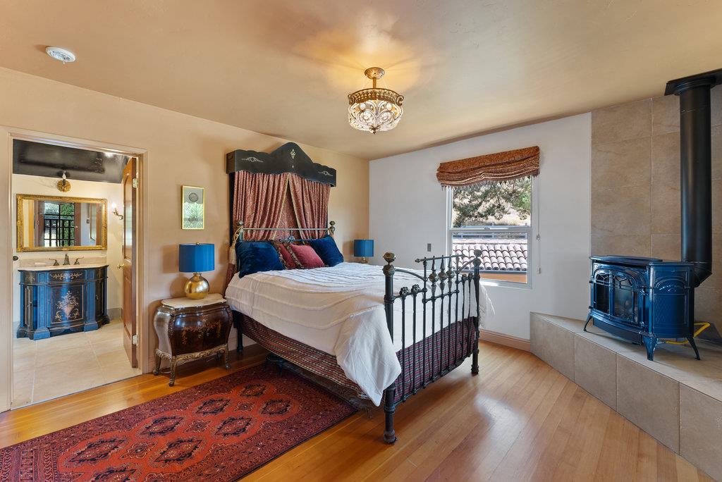 2970 Freedom Boulevard Watsonville, CA 95076 - Photo 20 of 58 a bed room with a bed and a chandelier