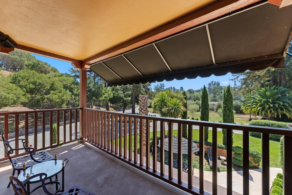 2970 Freedom Boulevard Watsonville, CA 95076 - Photo 21 of 58 a view of a roof deck with table and chairs under an umbrella