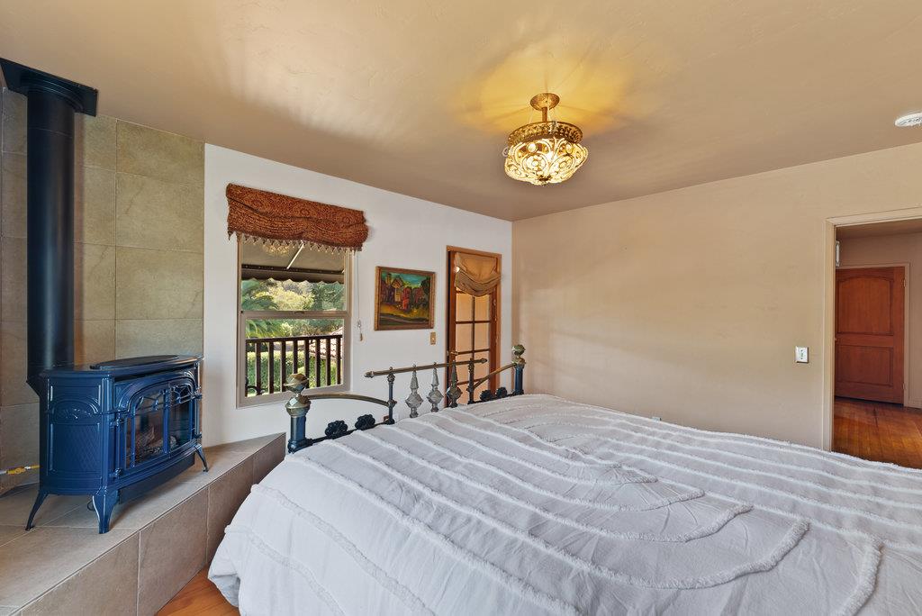 2970 Freedom Boulevard Watsonville, CA 95076 - Photo 22 of 58 a bedroom with a bed and a table with chair