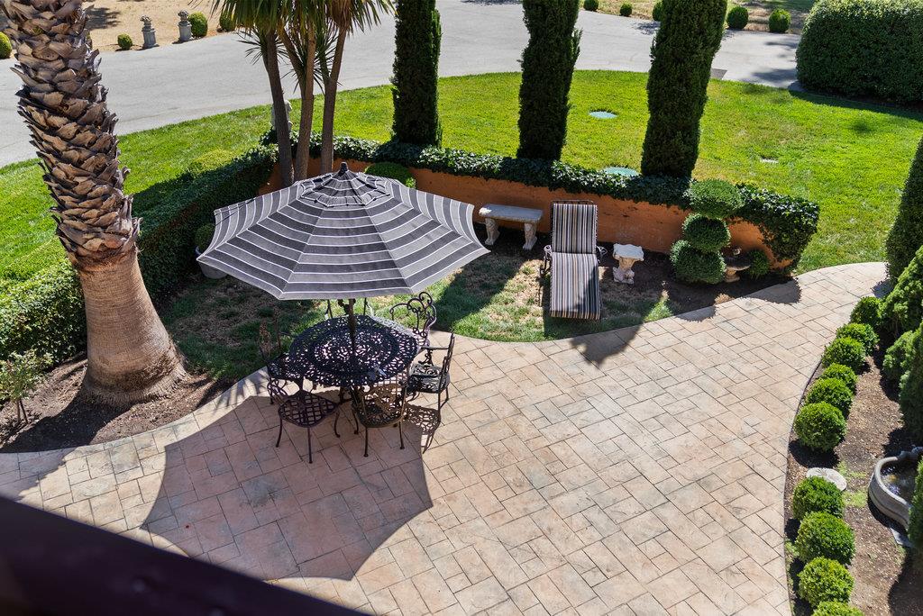 2970 Freedom Boulevard Watsonville, CA 95076 - Photo 32 of 58 a view of a patio with table and chairs potted plants and palm tree