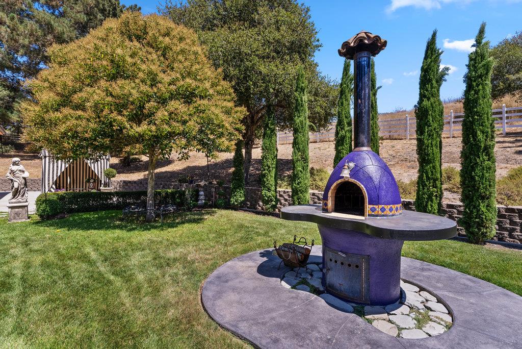 2970 Freedom Boulevard Watsonville, CA 95076 - Photo 35 of 58 a front view of a house with garden and trees