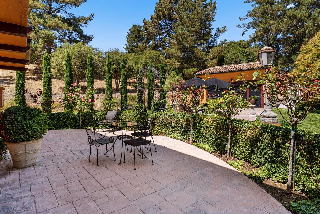 2970 Freedom Boulevard Watsonville, CA 95076 - Photo 56 of 58 a patio with a table and chairs and potted plants