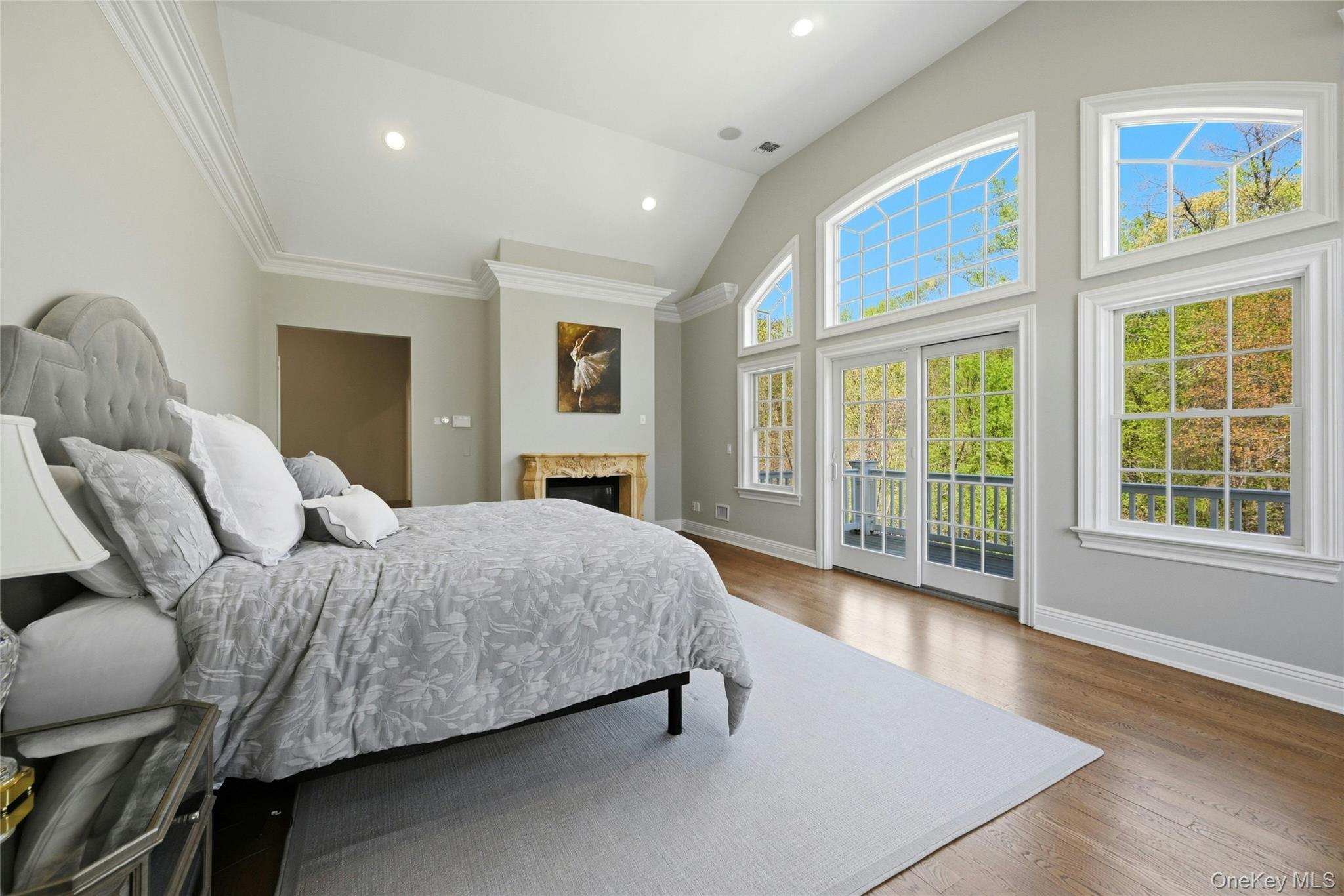 5 Mill Road Lloyd Harbor, NY 11743 - Photo 23 of 49 a spacious bedroom with a bed and wooden floor