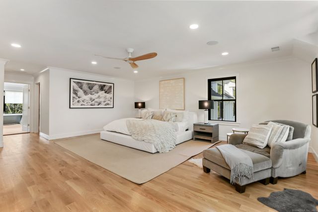 a living room with furniture and a painting