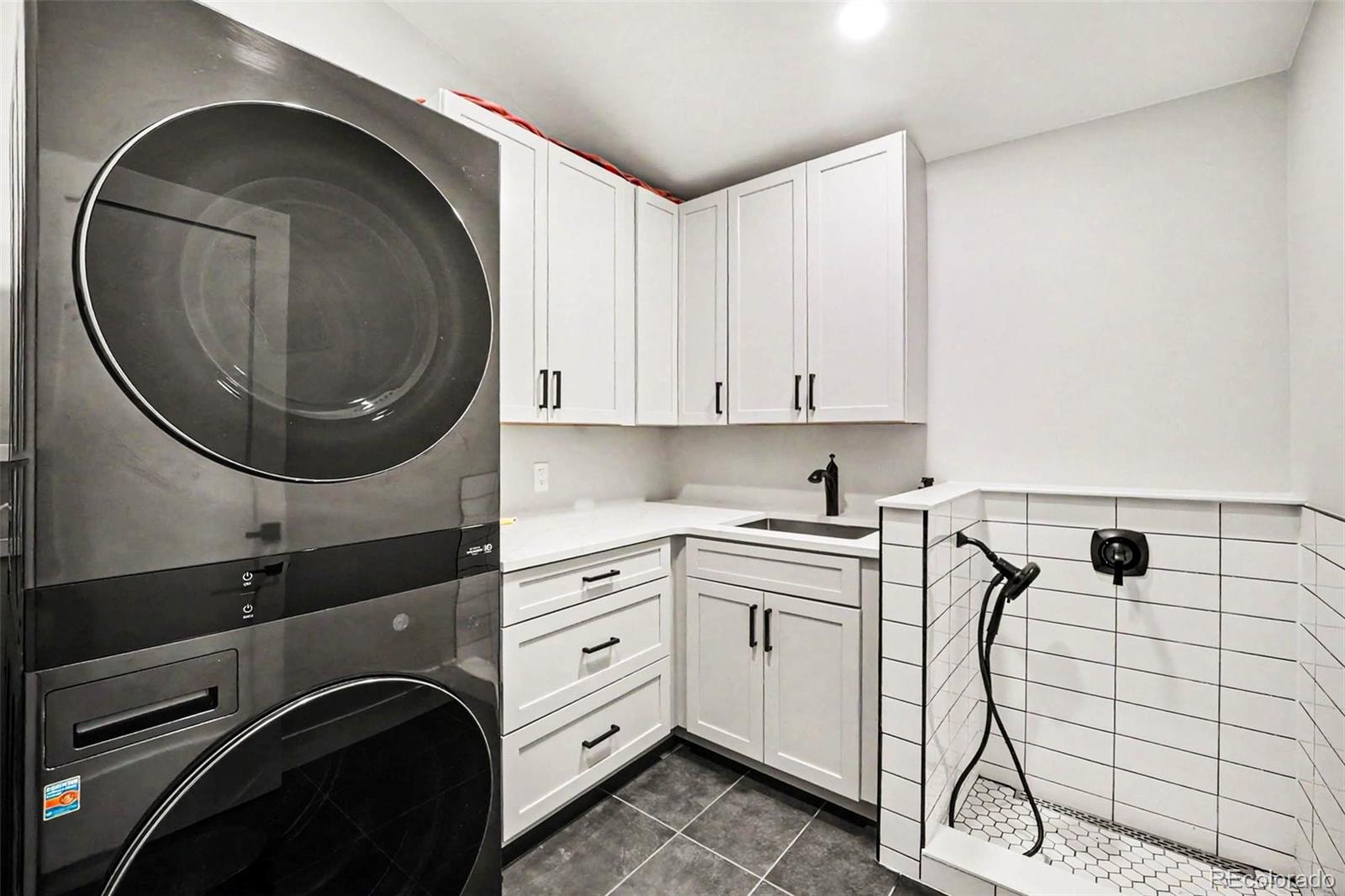 7231 Timber Trail Road Evergreen, CO 80439 - Photo 23 of 35 a utility room with dryer and washer