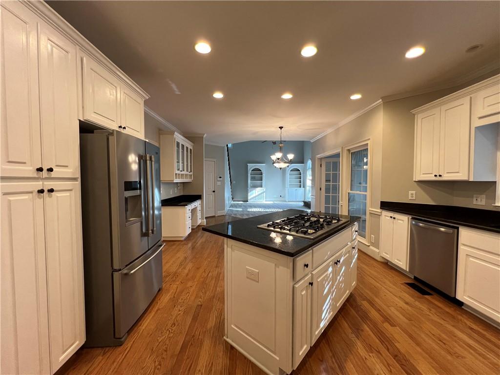 Undisclosed Address Kennesaw, GA 30144 - Photo 13 of 51 a kitchen with stainless steel appliances granite countertop a stove and a refrigerator