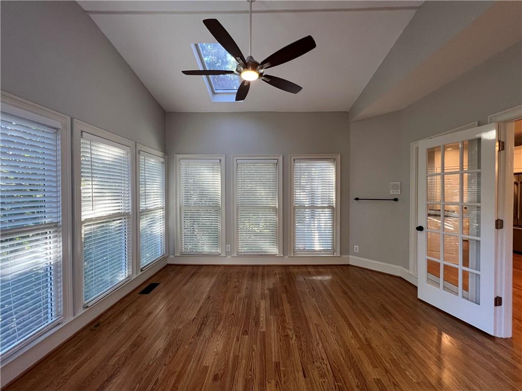 Undisclosed Address Kennesaw, GA 30144 - Photo 16 of 51 a view of a livingroom with wooden floor and a ceiling fan