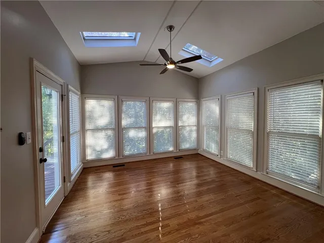 a view of an entryway with wooden floor