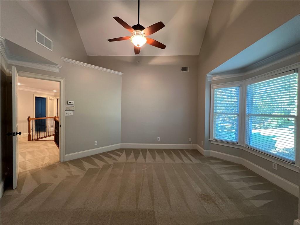 Undisclosed Address Kennesaw, GA 30144 - Photo 22 of 51 an empty room with chandelier fan and windows