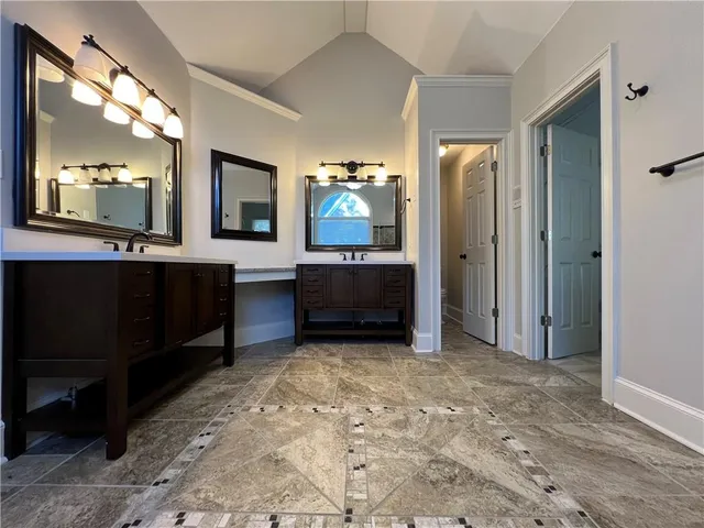 a view of cabinets and a kitchen with kitchen island