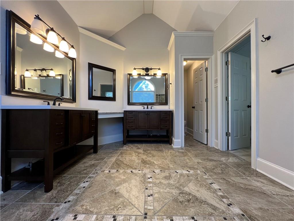 Undisclosed Address Kennesaw, GA 30144 - Photo 23 of 51 a view of cabinets and a kitchen with kitchen island
