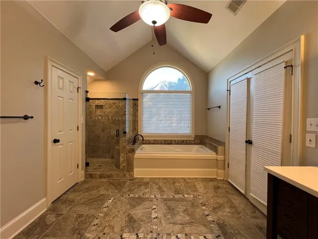 a view of entryway with wooden floor and a large window