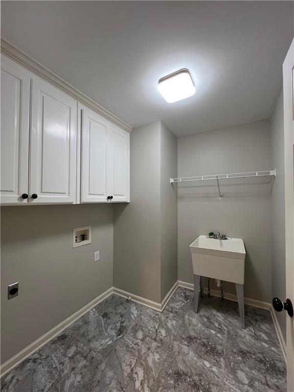 Undisclosed Address Kennesaw, GA 30144 - Photo 30 of 51 a room with a sink and cabinets