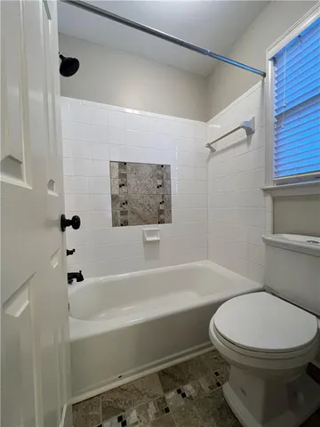 a bathroom with a double vanity sink and mirror