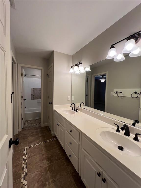 Undisclosed Address Kennesaw, GA 30144 - Photo 36 of 51 a spacious bathroom with a double vanity sink and mirror with shower