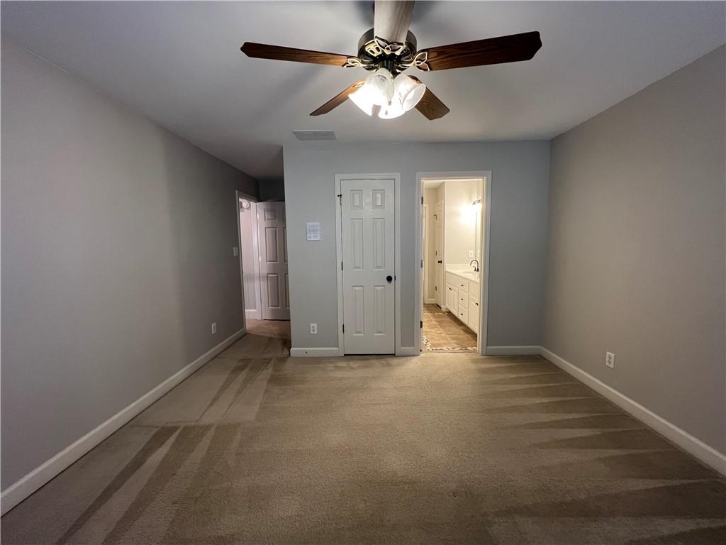 Undisclosed Address Kennesaw, GA 30144 - Photo 37 of 51 a view of an empty room with a ceiling fan