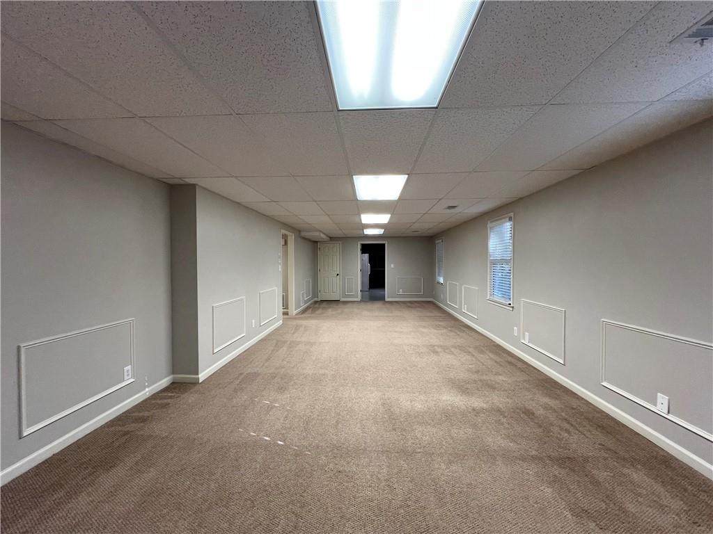 Undisclosed Address Kennesaw, GA 30144 - Photo 43 of 51 a view of an empty room with a window