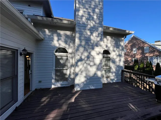 a view of a park with plants and large trees