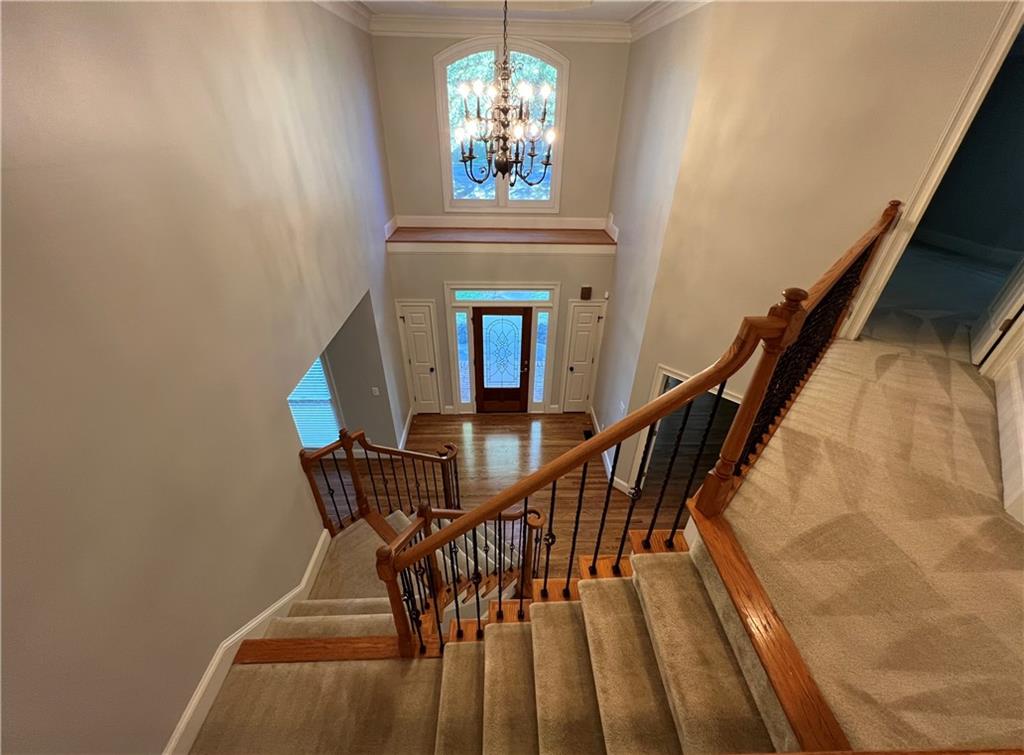 Undisclosed Address Kennesaw, GA 30144 - Photo 5 of 51 a dining room with furniture and a chandelier