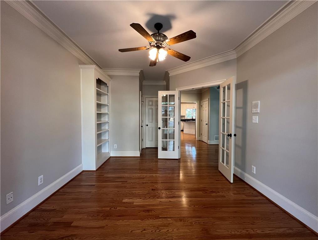 Undisclosed Address Kennesaw, GA 30144 - Photo 8 of 51 a view of an empty room with window and wooden floor