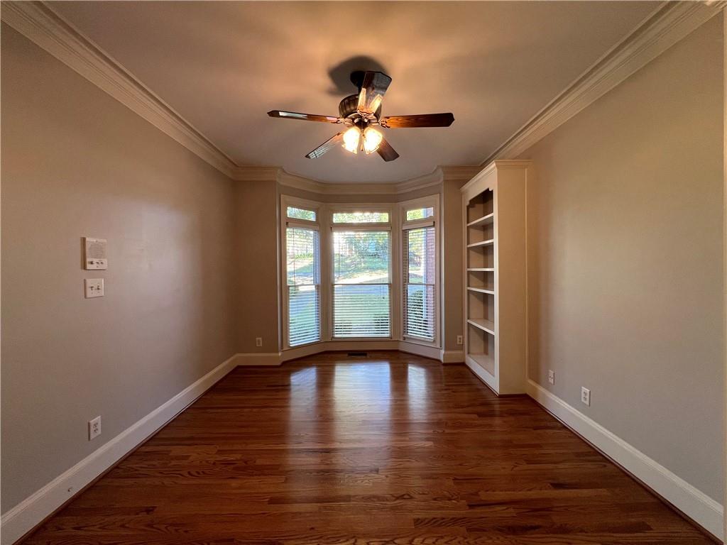 Undisclosed Address Kennesaw, GA 30144 - Photo 10 of 51 a view of an empty room with wooden floor and a window