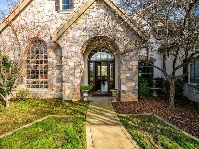 a living room with fireplace furniture and a flat screen tv
