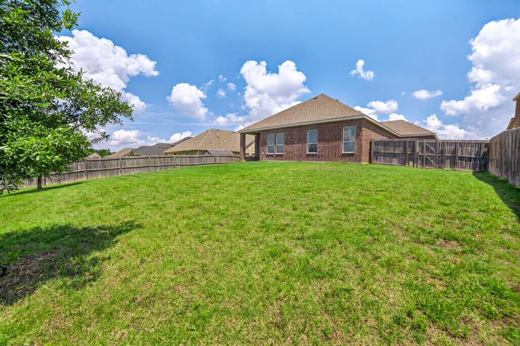 552 Winnetka Drive Oak Point, TX 75068 - Photo 36 of 40 a view of a house with a yard
