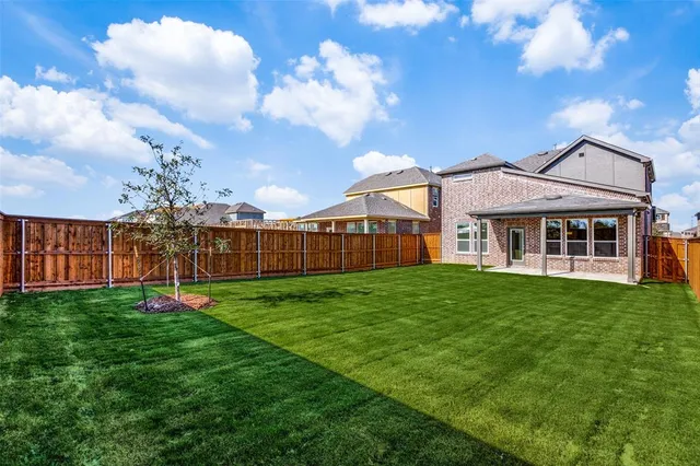 a view of a house with garden and yard