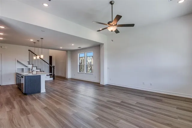 a view of livingroom and kitchen with wooden floor