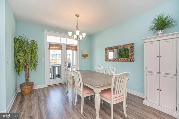 a view of a city from a balcony with furniture
