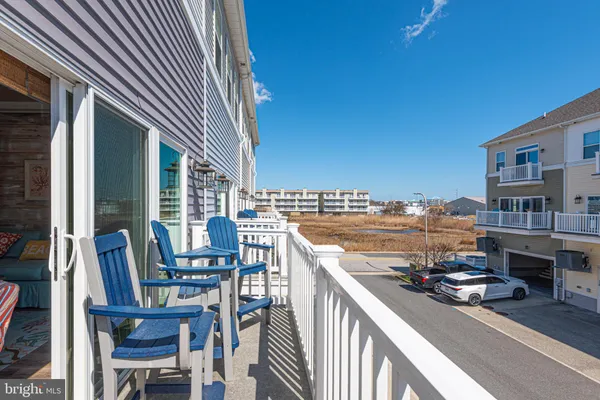 a kitchen with stainless steel appliances granite countertop a refrigerator sink and stove