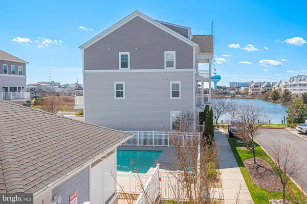a bathroom with a granite countertop sink a toilet and bathtub