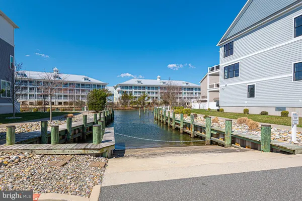 a dining room with furniture a rug and wooden floor