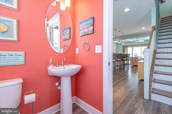 a bedroom with a large bed and a flat tv screen on dresser
