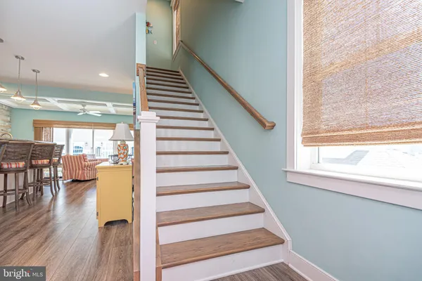 a view of a balcony with wooden floor