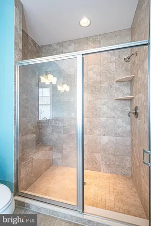 a front view of a residential apartment building with a yard