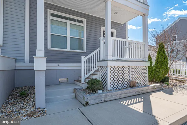 a kitchen with stainless steel appliances granite countertop a refrigerator sink and stove