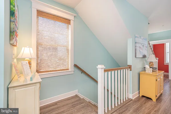 a view of a dining room with furniture wooden floor and chandelier