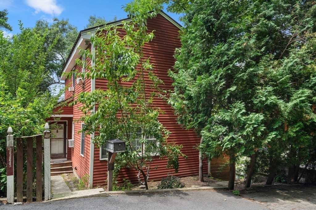 75 Russell Road Wellesley, MA 02482 - Photo 2 of 30 a front view of a house with a yard