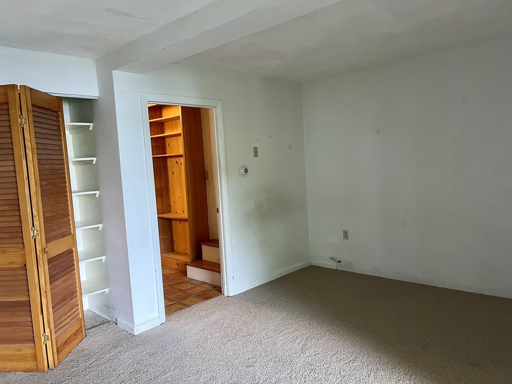 75 Russell Road Wellesley, MA 02482 - Photo 21 of 30 an empty room with an entryway door