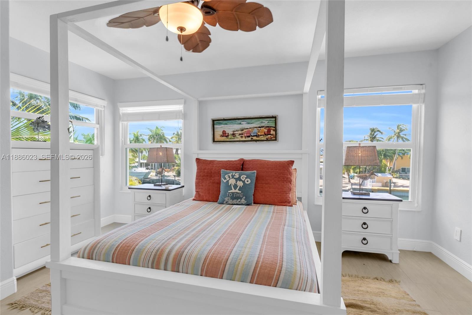 511 4th Street Key Colony Beach, FL 33051 - Photo 13 of 41 a bedroom with a large bed and a window