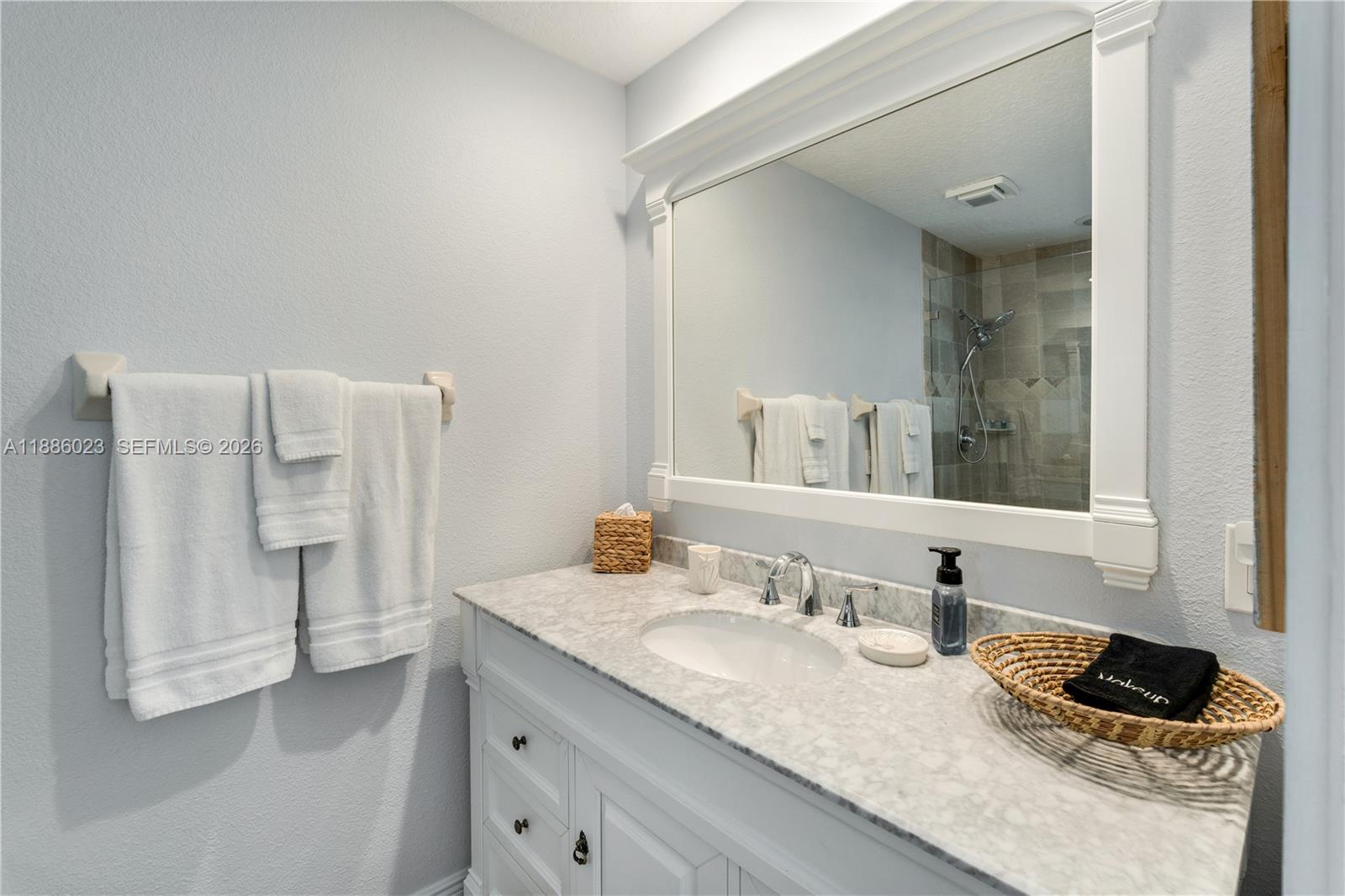 511 4th Street Key Colony Beach, FL 33051 - Photo 14 of 41 a bathroom with a granite countertop sink and a mirror