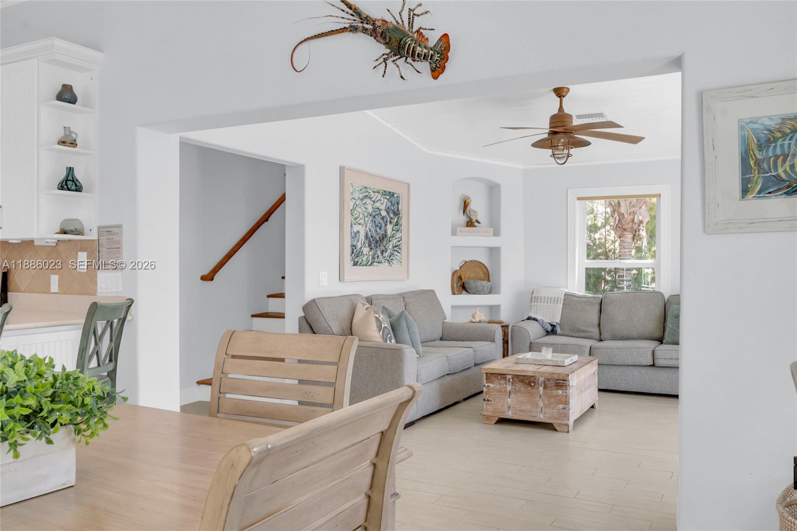 511 4th Street Key Colony Beach, FL 33051 - Photo 20 of 41 a living room with furniture ceiling fan and a window