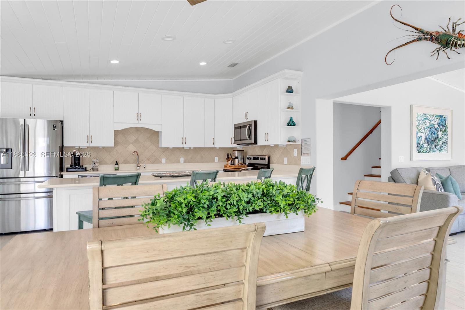 511 4th Street Key Colony Beach, FL 33051 - Photo 21 of 41 a kitchen with stainless steel appliances kitchen island sink stove and cabinets