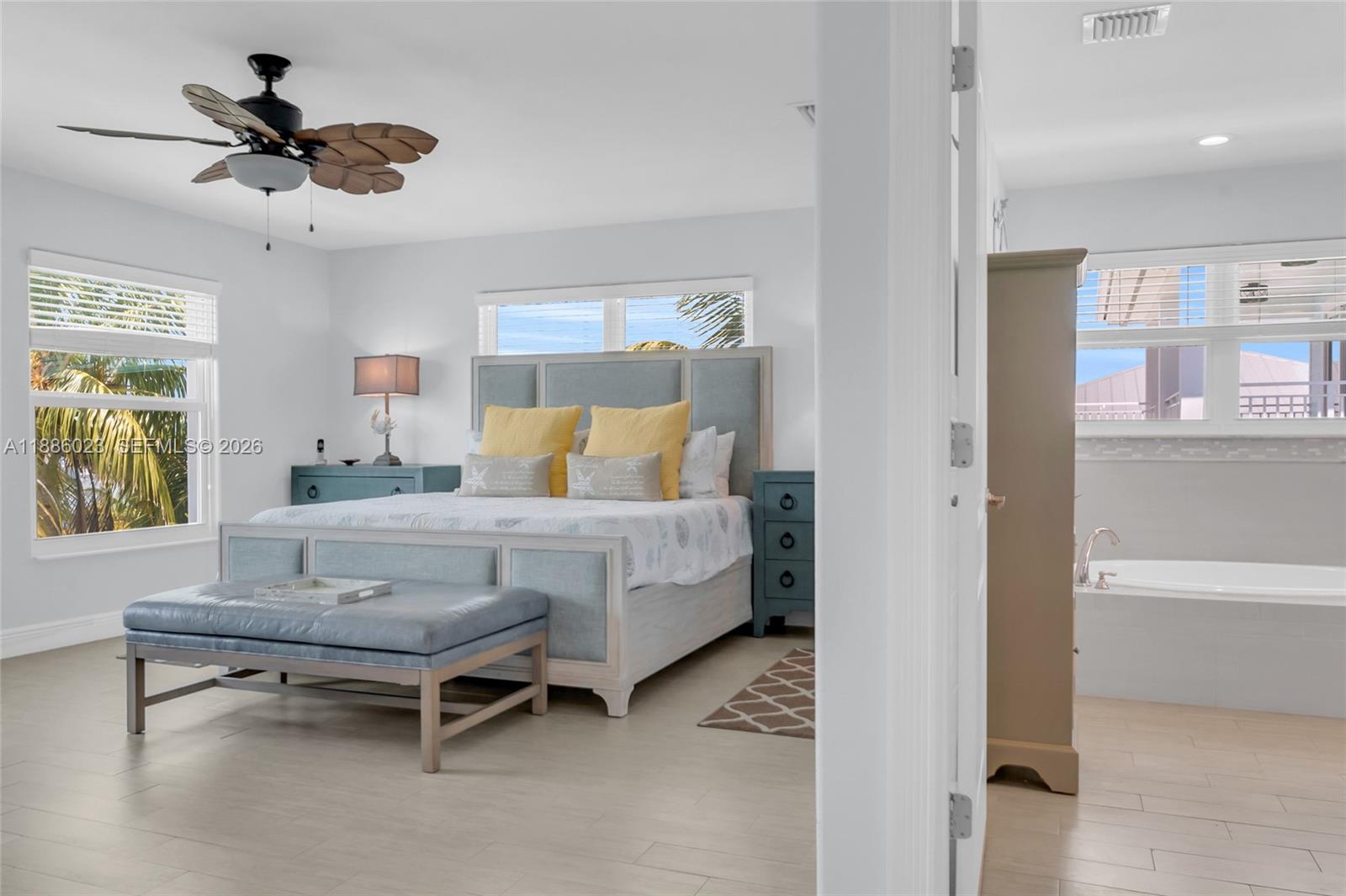 511 4th Street Key Colony Beach, FL 33051 - Photo 22 of 41 a bedroom with a bed and a window